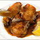 Image for article titled For the crispiest roast chicken, use a brick and it'll be browning slowly